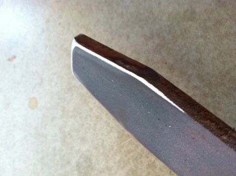 1977 Ford F-350 - A close-up view of a vehicle component, possibly part of the frame or body, with a distinct white edge.
