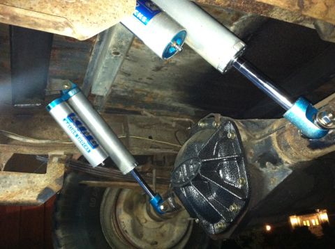 1977 Ford F-350 - Close-up of rear axle components, including King Racing Shocks and leaf springs.