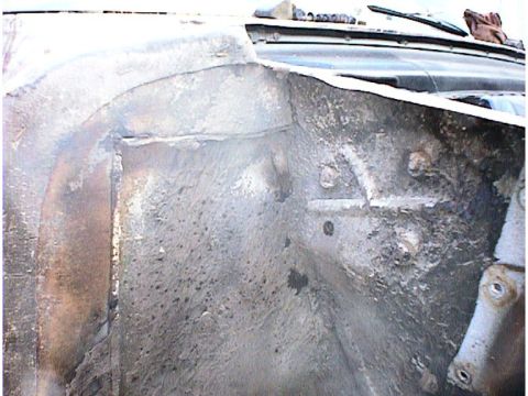 1960 Ford Falcon - This image shows the interior of a wheel well, with visible rust and wear. The registry claims it is a 1960 Ford Falcon, but the visual evi…