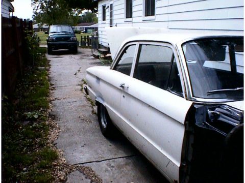 1960 Ford Falcon - White 1960 Ford Falcon sedan parked in driveway with front fender removed for work. Dark SUV in background.