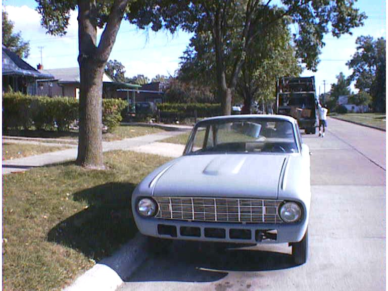 Gray 1960 Ford Falcon parked on a residential street, front view