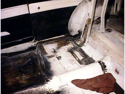 1960 Ford Falcon - Rust damage and repair on the interior floor pan of a car.