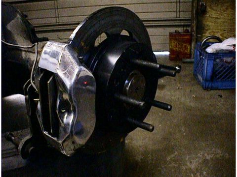 1960 Ford Falcon - Close-up of a chrome brake caliper and rotor assembly, likely for a custom build.