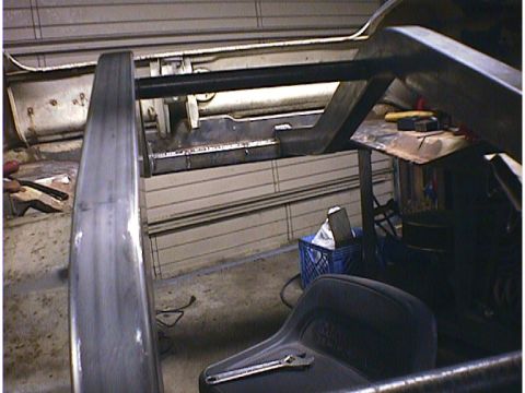 1960 Ford Falcon - Unidentified car frame and suspension parts are visible in this workshop setting.
