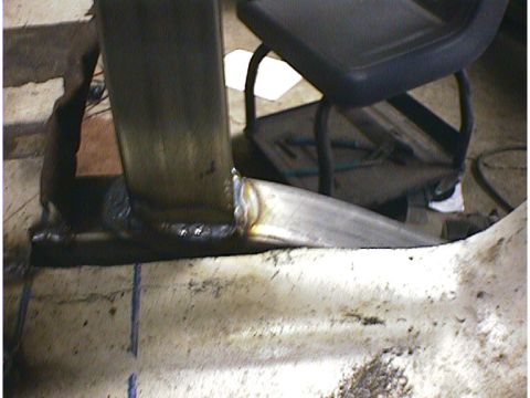 1960 Ford Falcon - A close-up view shows a freshly welded metal joint on what appears to be a vehicle's chassis or frame.