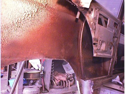 1960 Ford Falcon - The interior of a car door and wheel well show significant rust and damage, suggesting the vehicle is not a 1960 Ford Falcon as claimed.