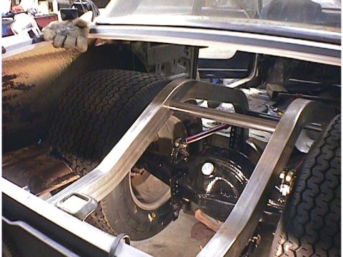 1960 Ford Falcon - Custom rear axle and suspension modifications are visible within the trunk of a vehicle.