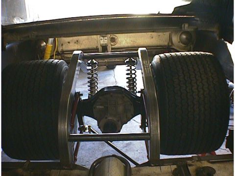 1960 Ford Falcon - Custom rear suspension and axle setup with wide tires, possibly for drag racing.