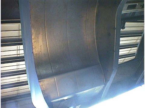 1960 Ford Falcon - The underside of a vehicle is visible, with a focus on the metal body panels and structural components.