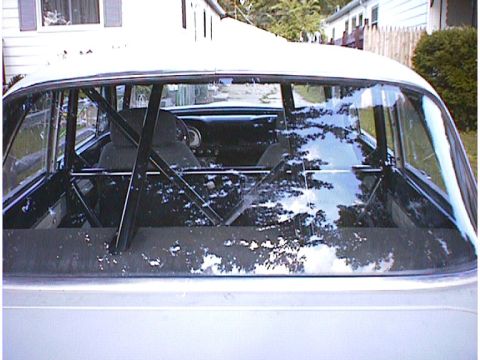 1960 Ford Falcon - Rear view of a 1960 Ford Falcon interior, modified with a roll cage.