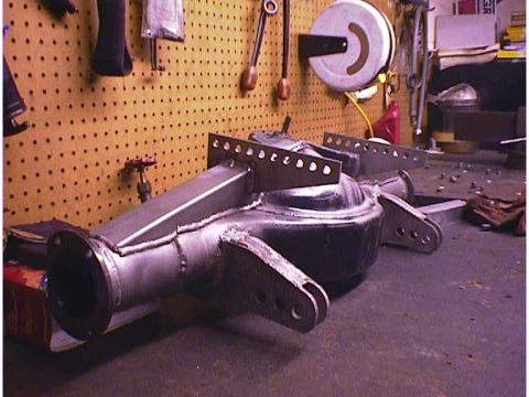 1960 Ford Falcon - A custom-fabricated rear axle assembly is shown in a workshop setting.