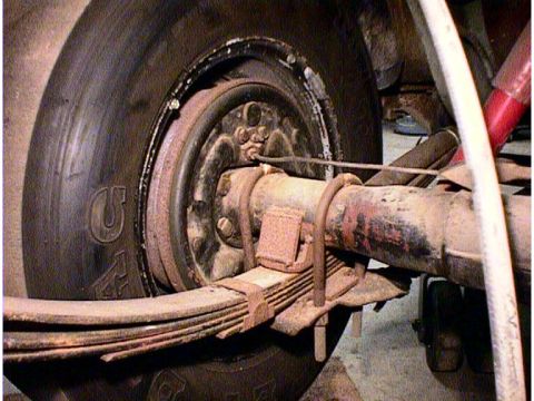 1960 Ford Falcon - The rear suspension system, including the axle and leaf springs, is shown in this close-up view.
