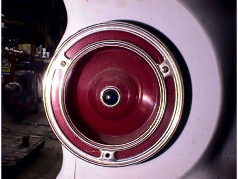 1960 Ford Falcon - A close-up of a vehicle's red taillight assembly with chrome trim is shown.
