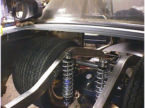 1960 Ford Falcon - Custom rear suspension components and a tire are visible in the trunk of a vehicle.