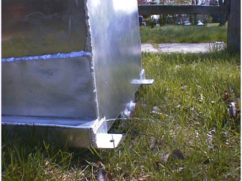 1960 Ford Falcon - Close-up view of an aluminum fuel tank, showing its construction and mounting hardware.