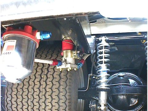 1960 Ford Falcon - Undercarriage view shows a fuel filter and custom suspension components, including coilover shocks.