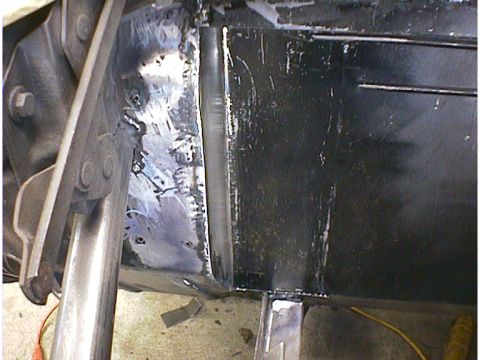 1960 Ford Falcon - Frame repair work in progress, showing welded metal sections.