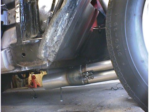 1960 Ford Falcon - Close-up view of the undercarriage and dual exhaust system of a vehicle.