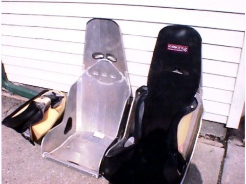 1960 Ford Falcon - Two racing seats are shown, one made of aluminum and the other black with a KIKKEY logo.