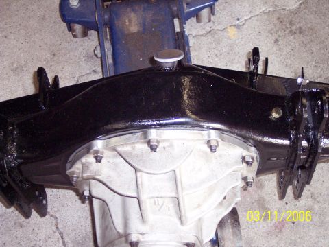 1960 Ford Falcon - Close-up of a rear axle assembly, likely aftermarket or rebuilt, with a date stamp visible.