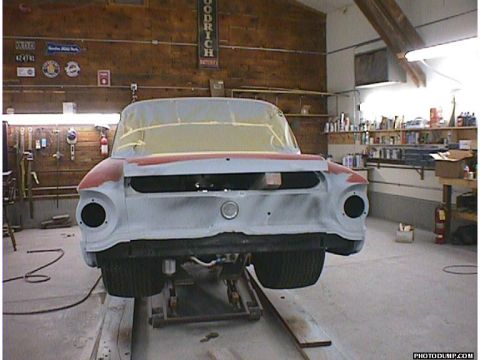 1960 Ford Falcon - A 1960 Ford Falcon is shown in a garage, undergoing bodywork and repairs.