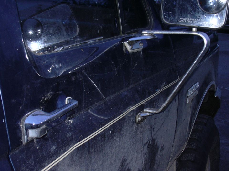 This is after I popped some of the dent out.  Luckily the glass didn't break and still roles up and down!