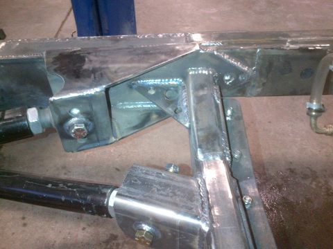 1985 Jeep CJ7 - Custom fabrication work on a Jeep CJ frame, showing suspension mounts and welded reinforcements.