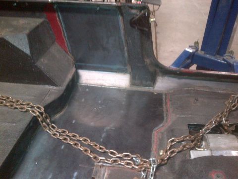 1985 Jeep CJ7 - Interior view of a 1985 Jeep CJ7, focusing on the floor pan and seat mounting points.