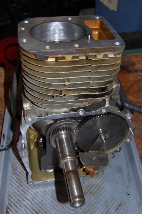 2006 Honda RANCHER - Close-up of an engine's internal components, including the cylinder block and gears, in a disassembled state.