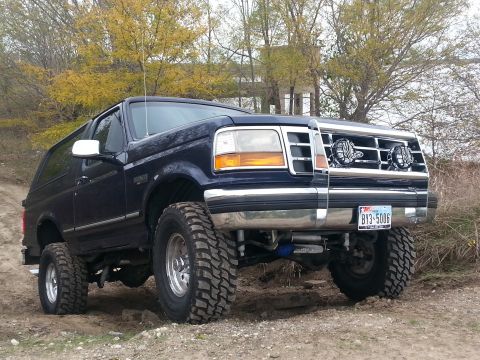 1995 Ford Bronco - This lifted Ford Bronco is equipped with large off-road tires and auxiliary lights on the grille.