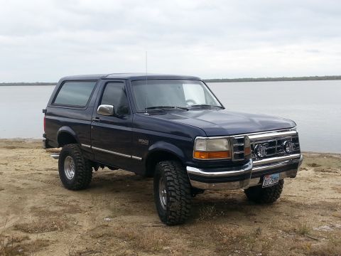 1995 Ford Bronco - This 1995 Ford Bronco is parked near the water, aftermarket wheels and tires.