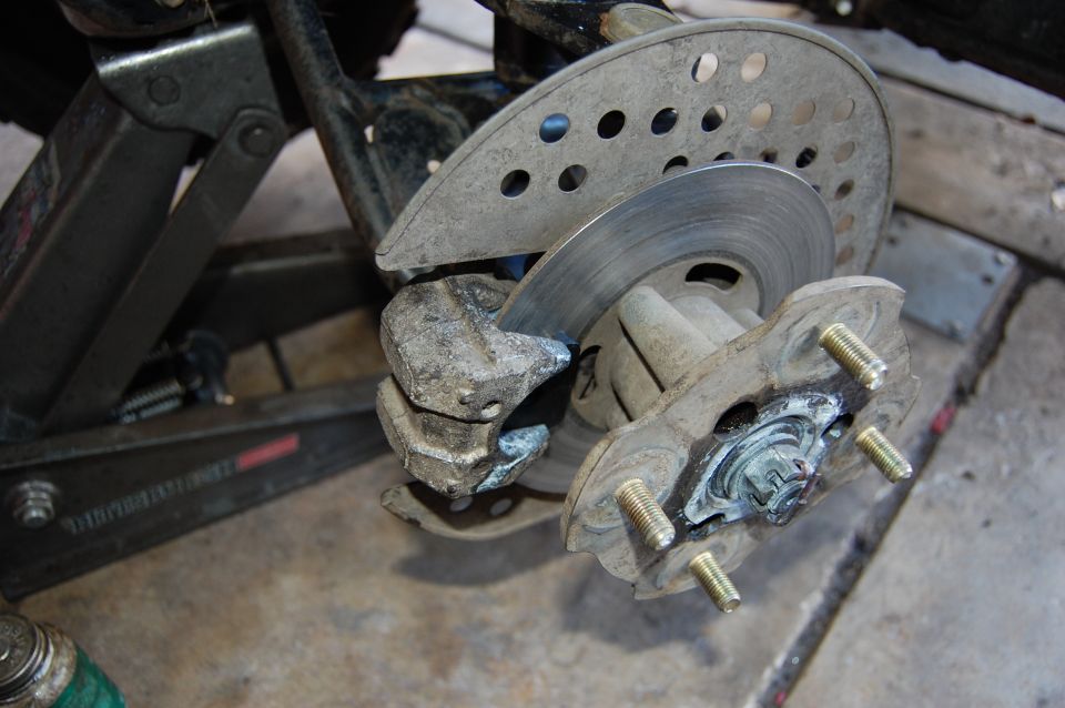 ATV brake caliper and rotor assembly with mounting studs