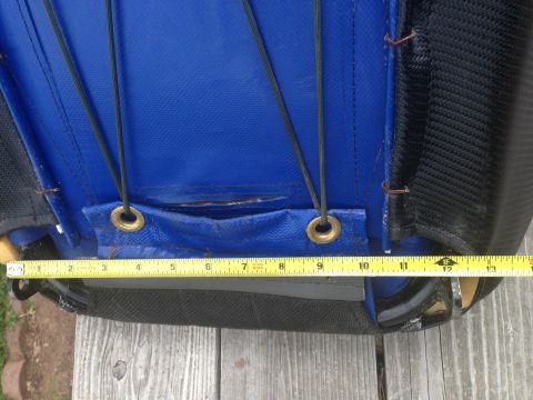 1986 Ford Bronco - A blue seat cover is shown with a tape measure indicating its dimensions.