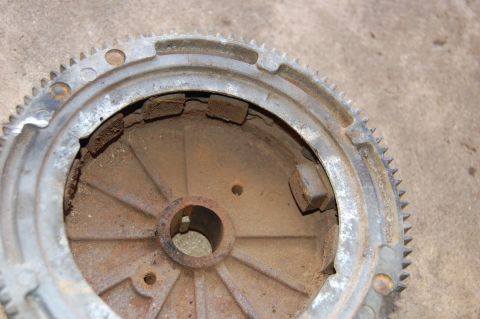 2006 Honda RANCHER - Close-up of a rusted flywheel, a component of an engine's rotating assembly.