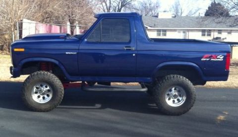 1982 Ford Bronco - This lifted blue 1982 Ford Bronco features an FX4 Off Road decal on the rear quarter panel.