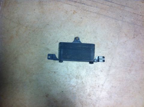 1982 Ford Bronco - This is an oil cooler with mounting brackets, likely for a vehicle.