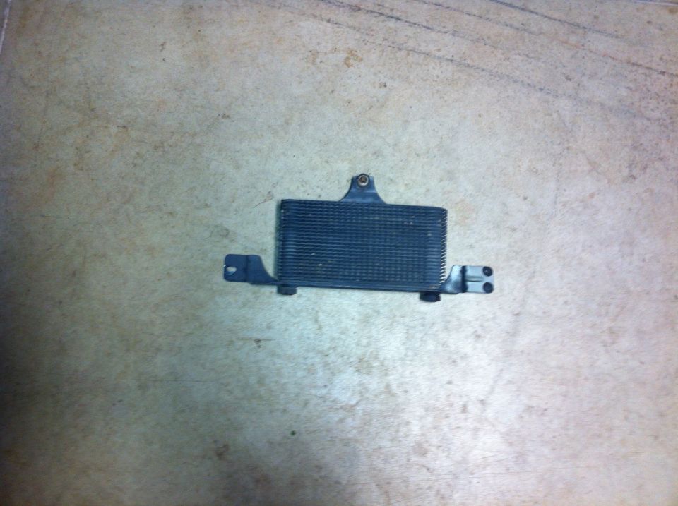 black metal oil cooler with mounting brackets