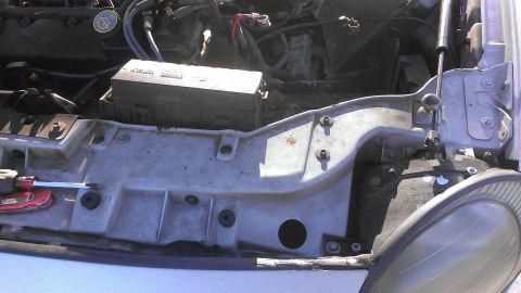 1990 Ford Bronco - Close-up view of engine bay components, including a fuse box and wiring harness.