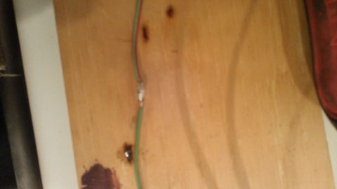 1990 Ford Bronco - A close-up shows a soldered wire splice with green and red wires.