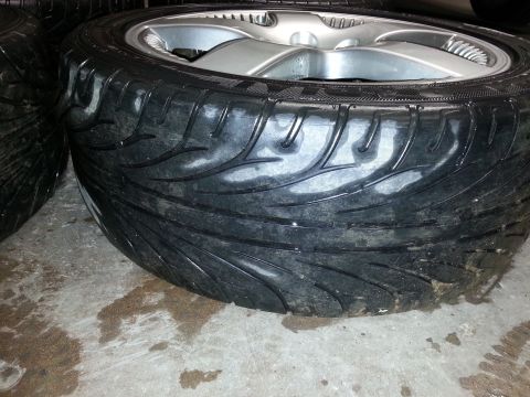 2002 Volkswagen Jetta - A close-up view of a tire and wheel assembly, showing the tread detail and rim.