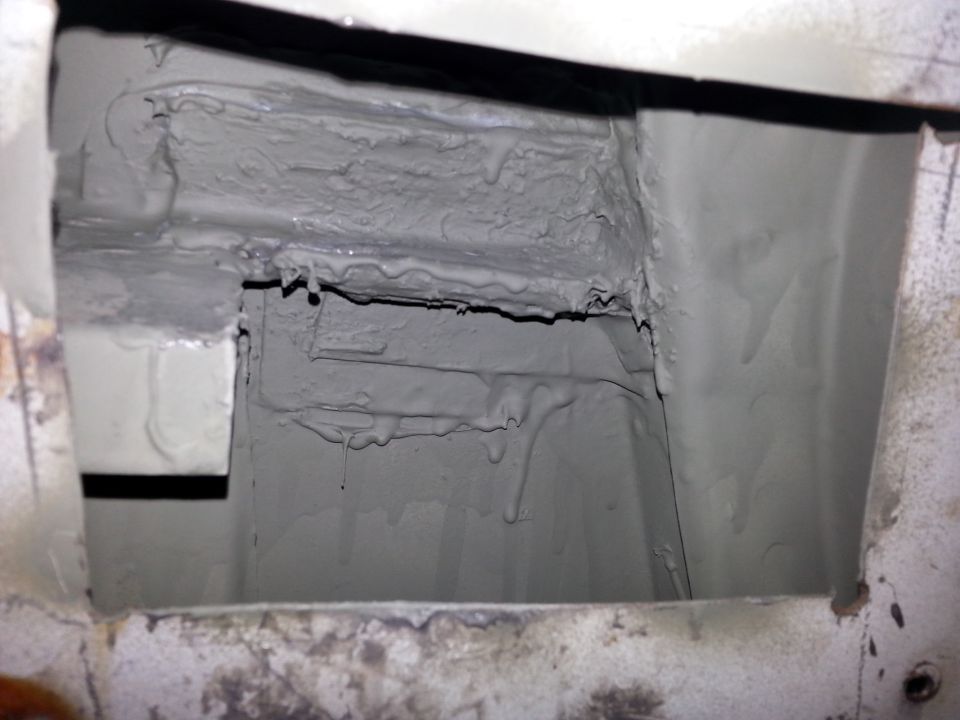 Close-up of seam sealant applied to a vehicle's underbody