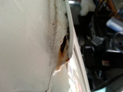 1992 Ford Bronco - This is the front of the driver's side rain gutter. Willing to bet that hole is all the way through..yay more rust.