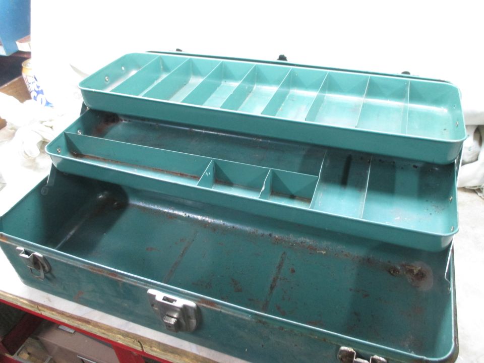 Green metal tackle box with multiple compartments and trays