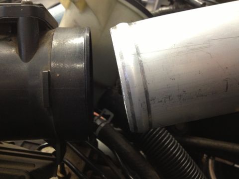 1998 Ford Crown Victoria - Engine intake components, including a sensor and a metal pipe, are shown in detail.