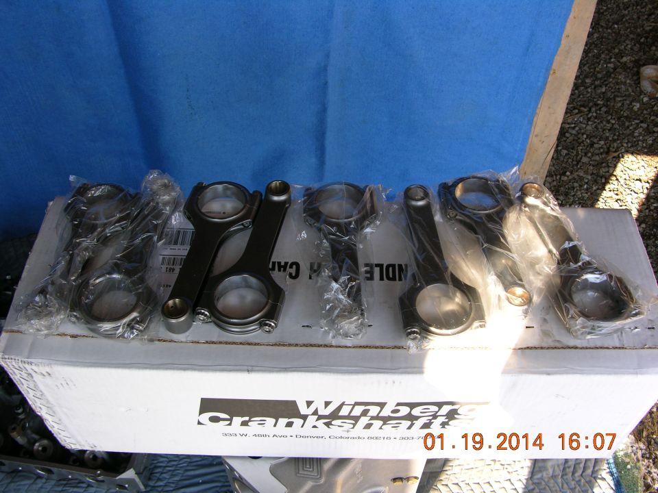 Set of six engine connecting rods in plastic packaging on a box labeled Winberg Crankshafts