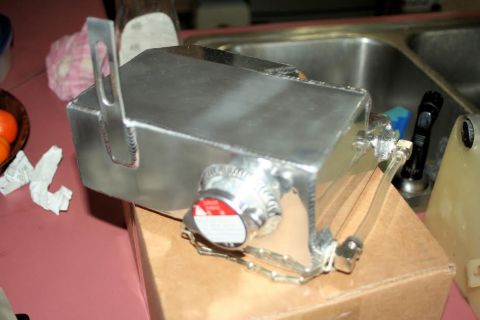 1976 Ford Ranchero - Close-up of an aftermarket aluminum radiator part, likely for a custom build.