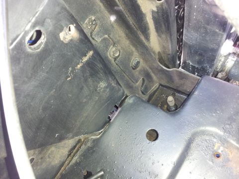 1976 Ford Ranchero - Close-up view of the radiator support area, showing structural components and mounting points.