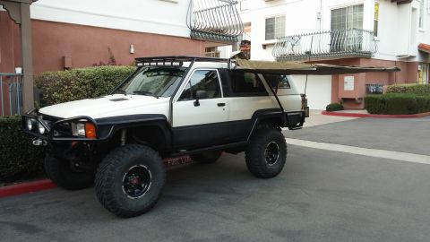1985 Toyota 4Runner - This modified 1985 Toyota 4Runner features an extended awning and roof-mounted lights.