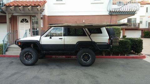 1985 Toyota 4Runner - This modified 1985 Toyota 4Runner features an extended awning and off-road tires.