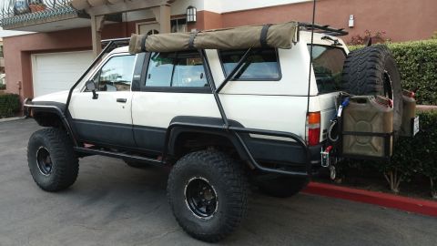 1985 Toyota 4Runner - This modified 1985 Toyota 4Runner features an awning and off-road tires, ready for adventure.